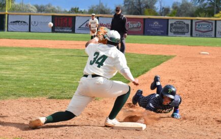 Landon Trimmell of Timpanogos dives back to first base while Provo's Elijah Aulava awaits the throws in a Region 8 baseball game on Tuesday, April 14, 2026.